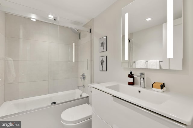 2939 Van Ness St NW Unit 424, Washington, DC 20008 - full bathroom featuring toilet, shower / bath combination with glass door, and vanity