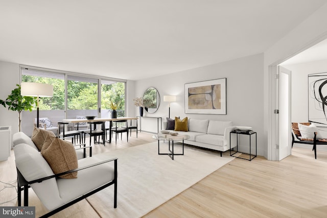 2939 Van Ness St NW Unit 424, Washington, DC 20008 - living area with wood finished floors and floor to ceiling windows
