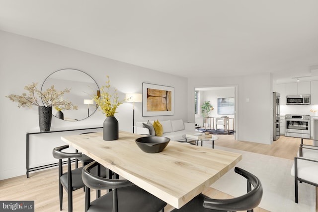 2939 Van Ness St NW Unit 424, Washington, DC 20008 - dining area with light wood-type flooring