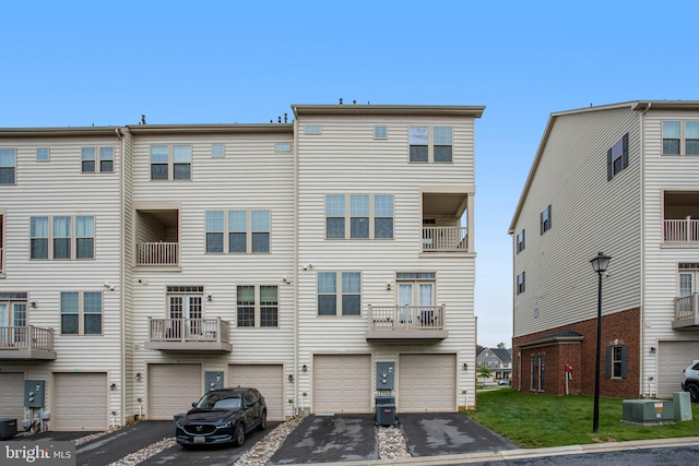 10117 Fosset St, Ijamsville, MD 21754 - back of house with driveway, a garage, and central AC unit