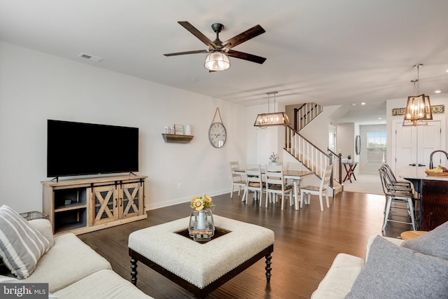 10117 Fosset St, Ijamsville, MD 21754 - living area featuring stairs, ceiling fan, wood finished floors, a chandelier, and recessed lighting