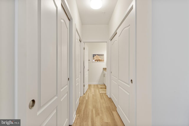 corridor with light wood finished floors