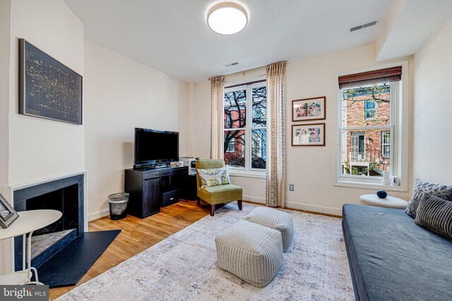 1702 Seaton St NW, Washington, DC 20009 - living room featuring healthy amount of natural light, wood finished floors, and baseboards