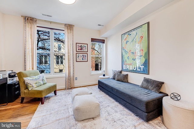 1702 Seaton St NW, Washington, DC 20009 - living area featuring light wood-type flooring and baseboards