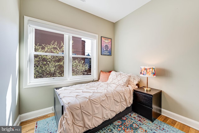 1702 Seaton St NW, Washington, DC 20009 - bedroom with baseboards and wood finished floors