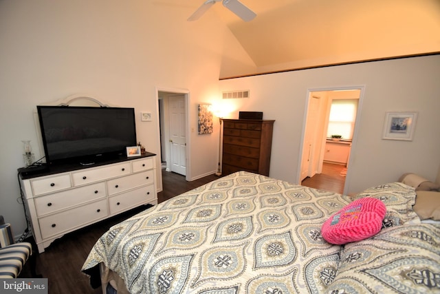 bedroom featuring dark wood-type flooring and high vaulted ceiling