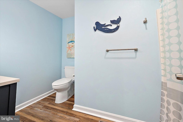 4 Abbey Cir, Ocean Pines, MD 21811 - bathroom featuring wood finished floors, toilet, baseboards, and vanity