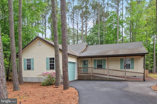 4 Abbey Cir, Ocean Pines, MD 21811 - ranch-style house featuring covered porch, a garage, driveway, and roof with shingles