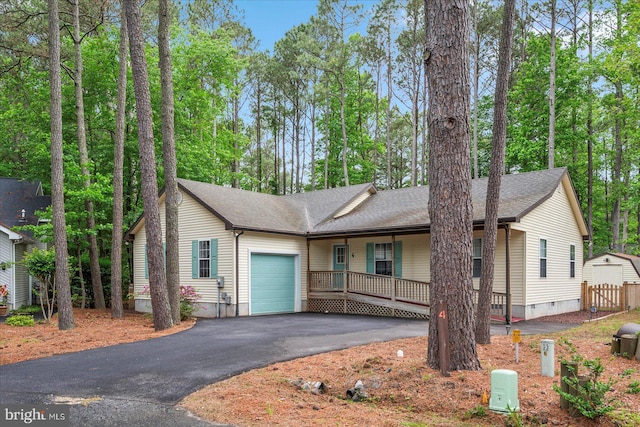 4 Abbey Cir, Ocean Pines, MD 21811 - ranch-style home with an attached garage, a porch, driveway, and a shingled roof