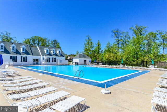 4 Abbey Cir, Ocean Pines, MD 21811 - community pool featuring fence and a patio