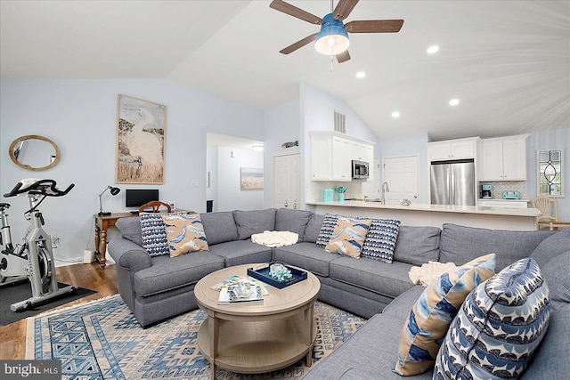 4 Abbey Cir, Ocean Pines, MD 21811 - living area with vaulted ceiling, wood finished floors, a ceiling fan, and recessed lighting