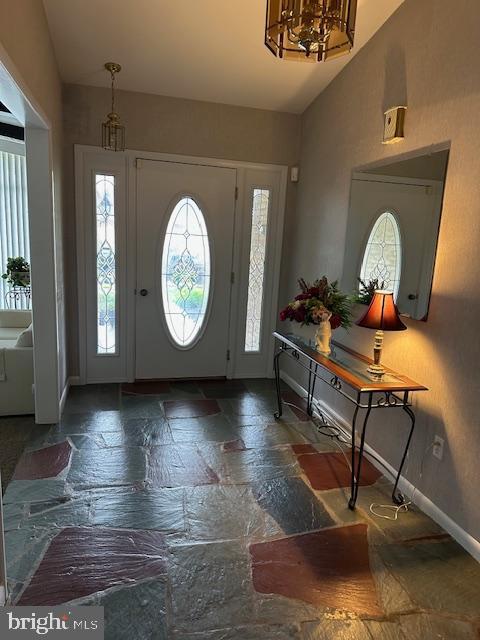 100 W Ave, Hanover, PA 17331 - entryway featuring stone tile flooring, baseboards, and lofted ceiling