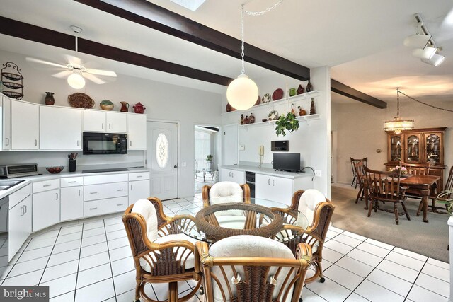 100 W Ave, Hanover, PA 17331 - dining area featuring beamed ceiling, light tile patterned floors, light carpet, and ceiling fan