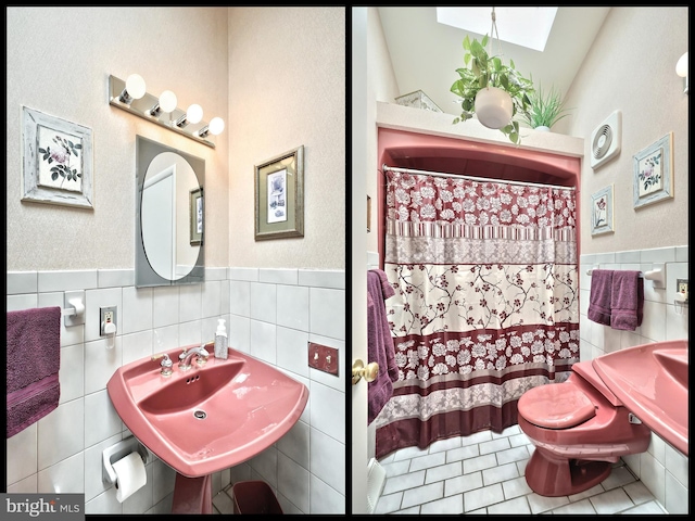 100 W Ave, Hanover, PA 17331 - bathroom with tile walls, a skylight, a wainscoted wall, tile patterned floors, and toilet