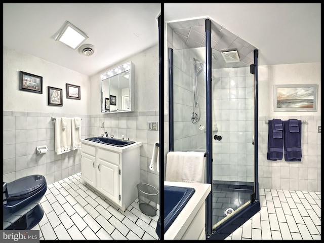 100 W Ave, Hanover, PA 17331 - bathroom featuring tile walls, a shower stall, vanity, toilet, and tile patterned flooring