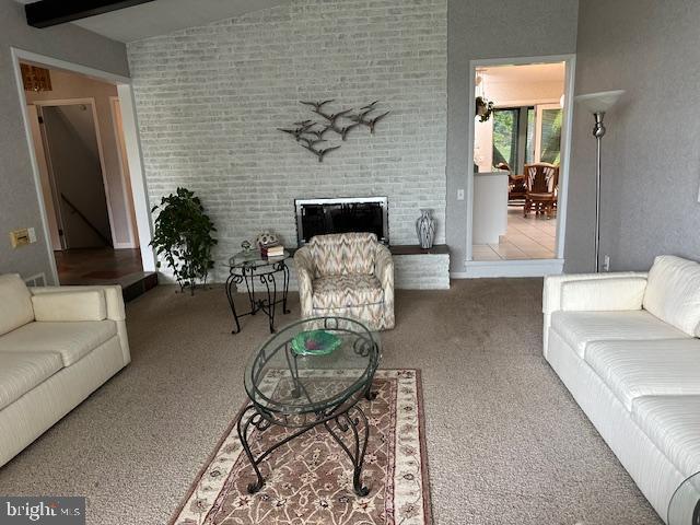 100 W Ave, Hanover, PA 17331 - carpeted living area with a brick fireplace
