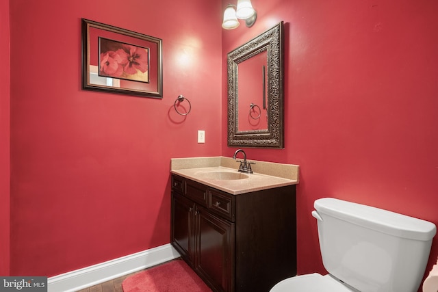 2005 Golden Ct, Mechanicsburg, PA 17055 - half bathroom featuring toilet, vanity, and baseboards
