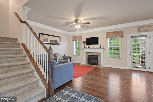 2005 Golden Ct, Mechanicsburg, PA 17055 - living area featuring wood finished floors, ceiling fan, ornamental molding, stairway, and a fireplace with flush hearth