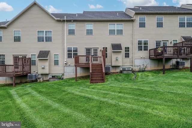 2005 Golden Ct, Mechanicsburg, PA 17055 - back of property with a wooden deck, central air condition unit, and a yard