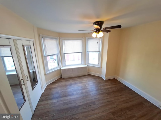 126 N Sickels St, Philadelphia, PA 19139 - empty room with dark wood finished floors, a ceiling fan, and baseboards