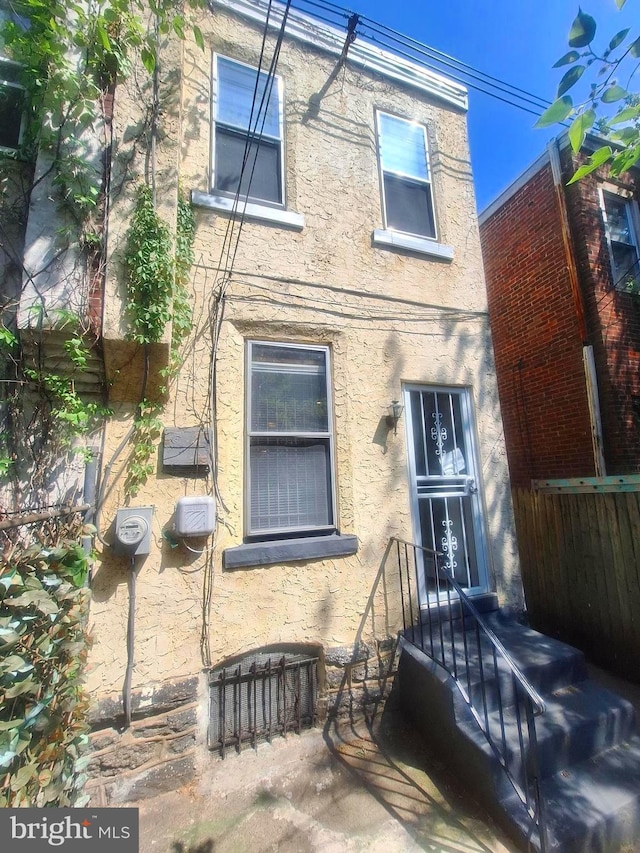 126 N Sickels St, Philadelphia, PA 19139 - back of house featuring stucco siding