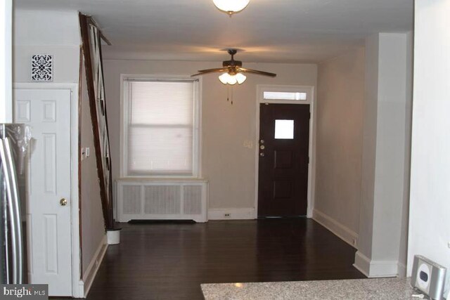 126 N Sickels St, Philadelphia, PA 19139 - foyer entrance with radiator, a ceiling fan, baseboards, and wood finished floors