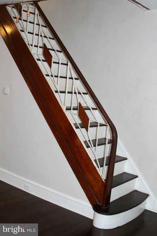 126 N Sickels St, Philadelphia, PA 19139 - stairway featuring baseboards and wood finished floors