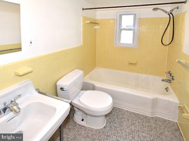 2626 12th St S Unit 1, Arlington, VA 22204 - full bath with a sink, tile walls, toilet, shower / bathtub combination, and wainscoting