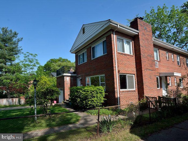 2626 12th St S Unit 1, Arlington, VA 22204 - view of property exterior featuring a chimney, brick siding, and a balcony