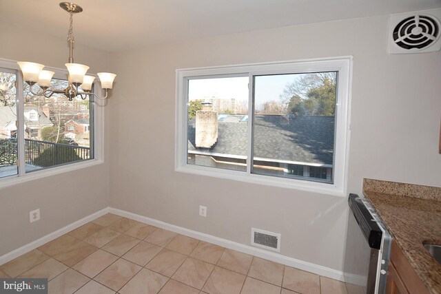 2626 12th St S Unit 1, Arlington, VA 22204 - unfurnished dining area with light tile patterned flooring, a chandelier, and baseboards