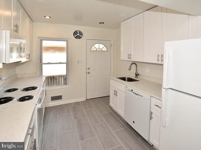 2626 12th St S Unit 1, Arlington, VA 22204 - kitchen featuring white appliances, a sink, white cabinetry, light countertops, and recessed lighting