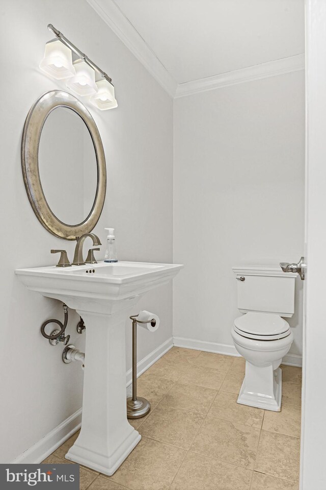 11904 Paradise Ln, Herndon, VA 20171 - half bathroom featuring crown molding, toilet, tile patterned flooring, and baseboards