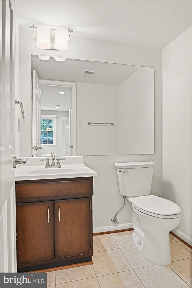 11904 Paradise Ln, Herndon, VA 20171 - bathroom with vanity, tile patterned flooring, toilet, and baseboards