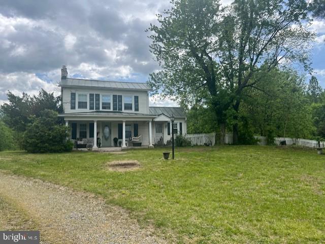 349 Greenbank Rd, Fredericksburg, VA 22406 - traditional home featuring covered porch, a chimney, metal roof, and a standing seam roof
