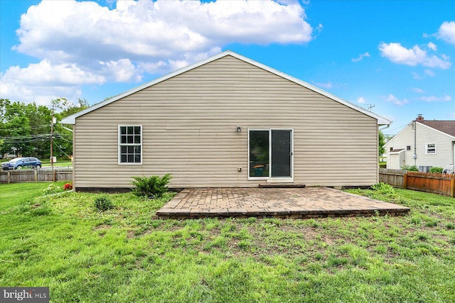 rear view of property featuring a patio area