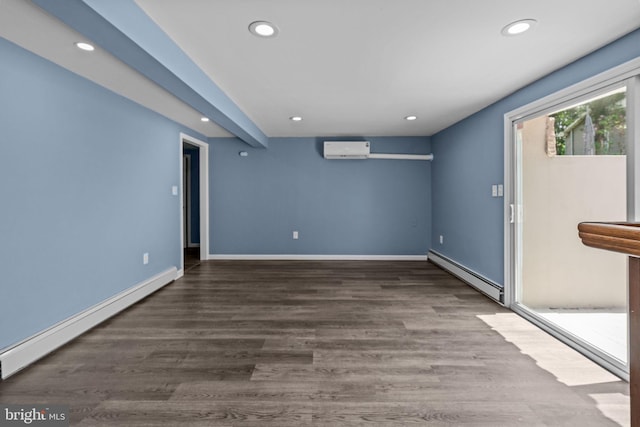 spare room featuring a baseboard heating unit, an AC wall unit, baseboard heating, recessed lighting, and baseboards