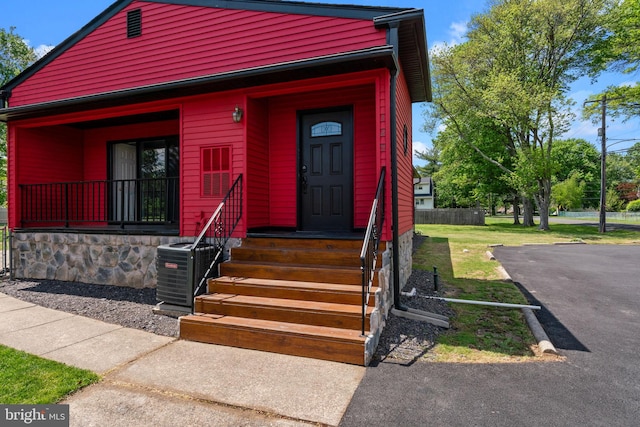 view of front of home featuring cooling unit