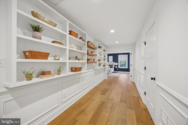 17 W Redman Ave, Haddonfield, NJ 08033 - hallway featuring light wood-style floors, recessed lighting, a decorative wall, a wainscoted wall, and built in features