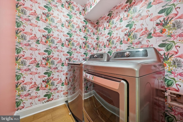 17 W Redman Ave, Haddonfield, NJ 08033 - laundry area featuring washing machine and dryer, wallpapered walls, baseboards, and wood finished floors