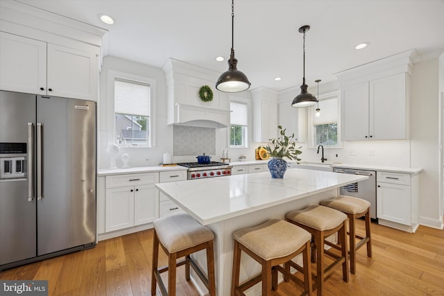 17 W Redman Ave, Haddonfield, NJ 08033 - kitchen with stainless steel appliances, light wood-style flooring, white cabinetry, and recessed lighting