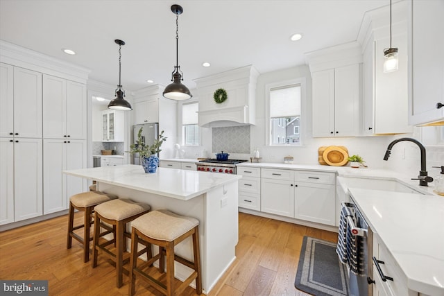 17 W Redman Ave, Haddonfield, NJ 08033 - kitchen with a sink, freestanding refrigerator, white cabinetry, backsplash, and recessed lighting