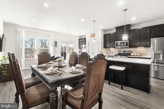6034 Goshawk St, New Market, MD 21774 - dining space with light wood-type flooring and recessed lighting