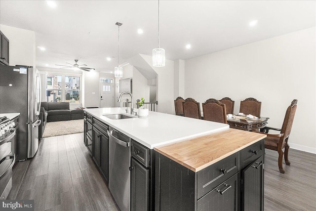 6034 Goshawk St, New Market, MD 21774 - kitchen with a sink, open floor plan, dark cabinetry, stainless steel appliances, and recessed lighting