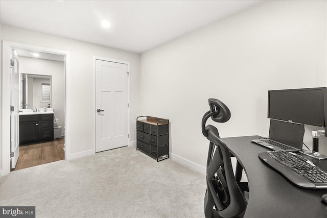 6034 Goshawk St, New Market, MD 21774 - carpeted home office with baseboards and a sink