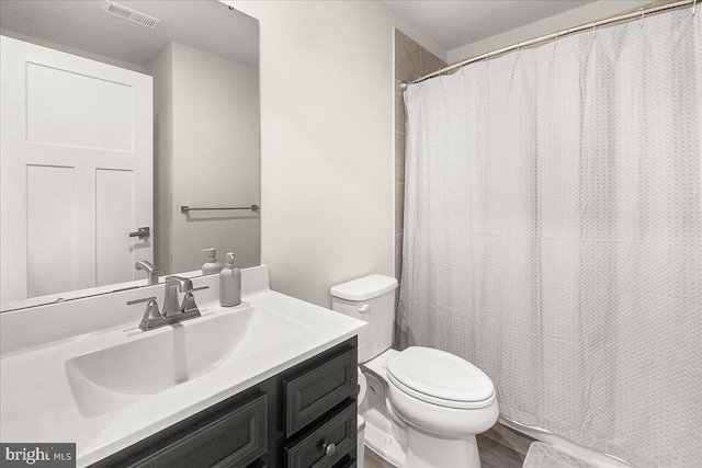 6034 Goshawk St, New Market, MD 21774 - full bath featuring toilet, vanity, and wood finished floors