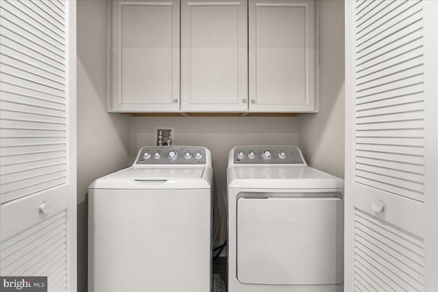 6034 Goshawk St, New Market, MD 21774 - washroom featuring washer and clothes dryer and cabinet space