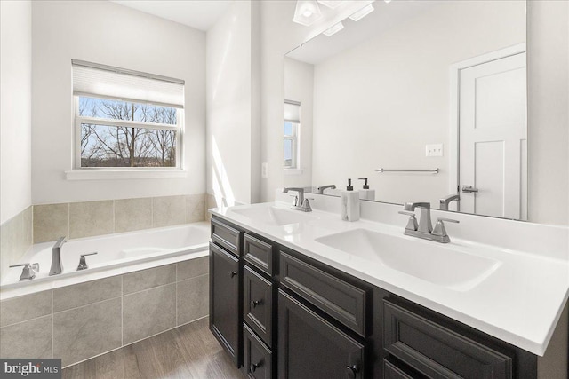 6034 Goshawk St, New Market, MD 21774 - full bath with a garden tub, double vanity, and wood finished floors