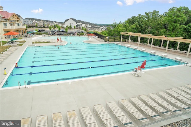 6034 Goshawk St, New Market, MD 21774 - community pool featuring a pergola and a patio area