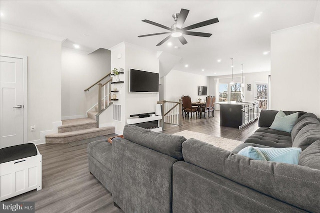 6034 Goshawk St, New Market, MD 21774 - living room featuring wood finished floors, a ceiling fan, stairs, recessed lighting, and baseboards