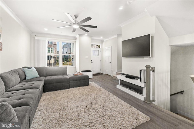 6034 Goshawk St, New Market, MD 21774 - living room with crown molding, dark wood-type flooring, ceiling fan, recessed lighting, and baseboards